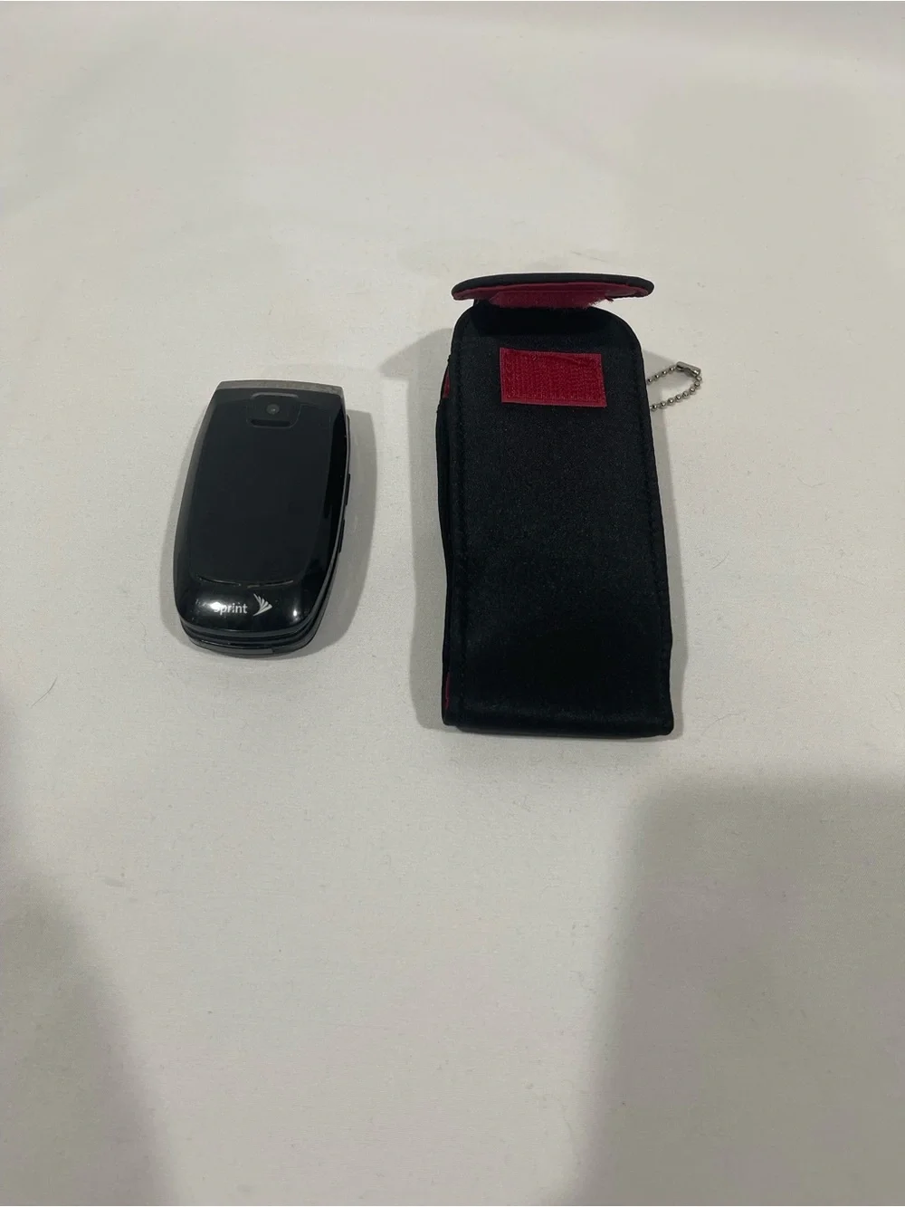 Samsung Black Flip Phone with Black Holster
